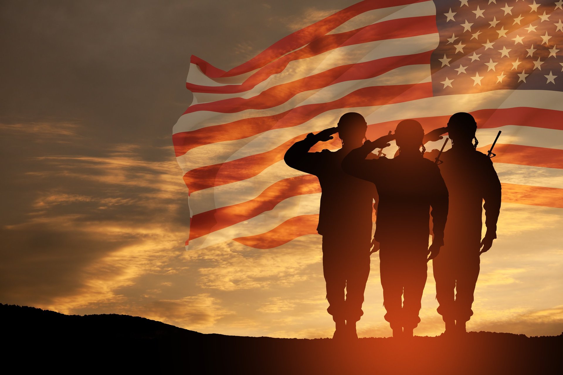 USA army soldiers saluting with American flag